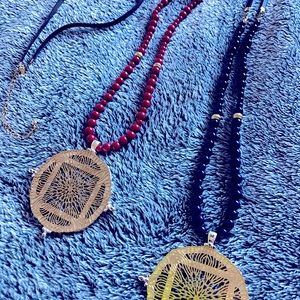 Set of 2 long beaded necklaces with medallion